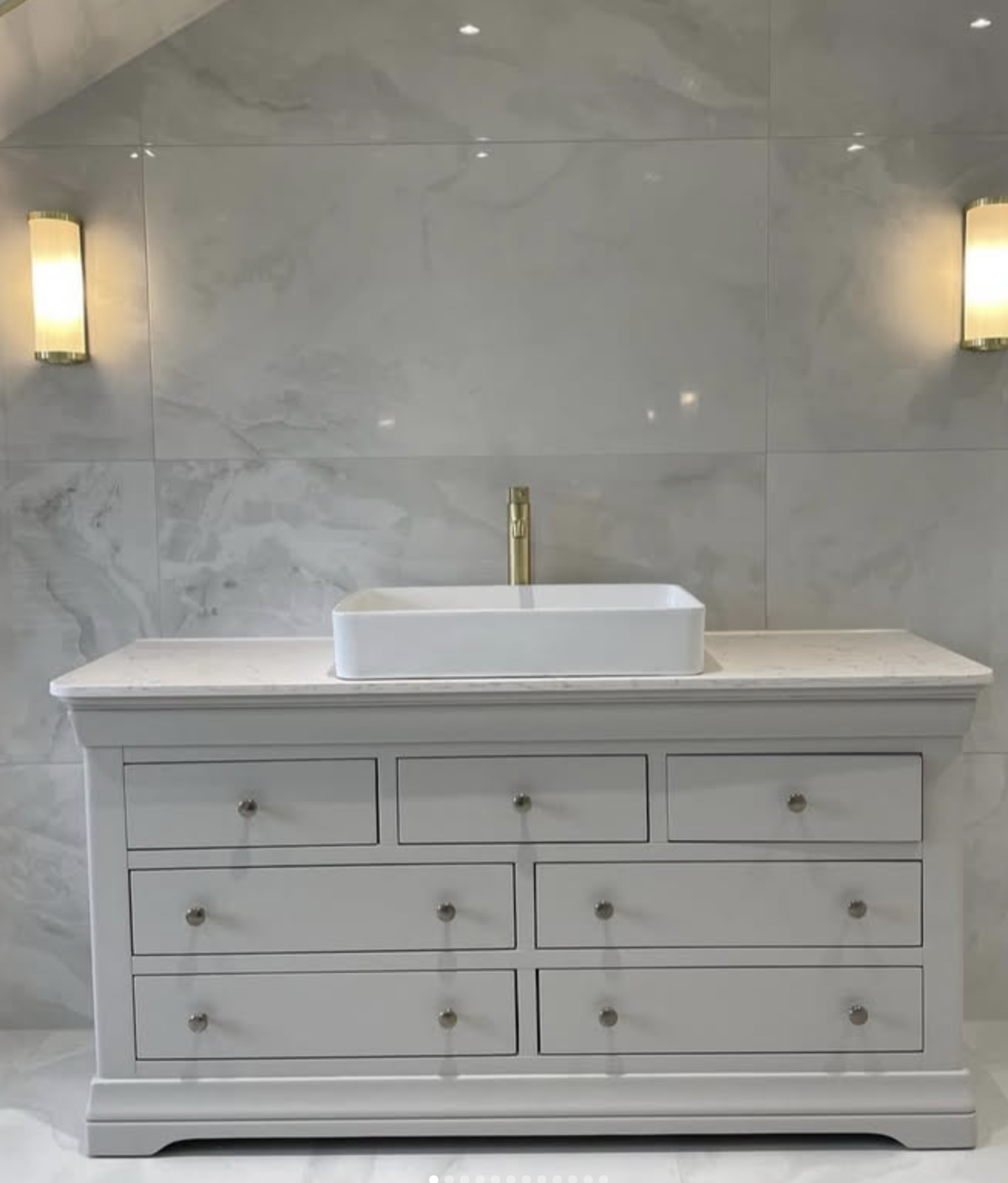 White vanity with marble splashback